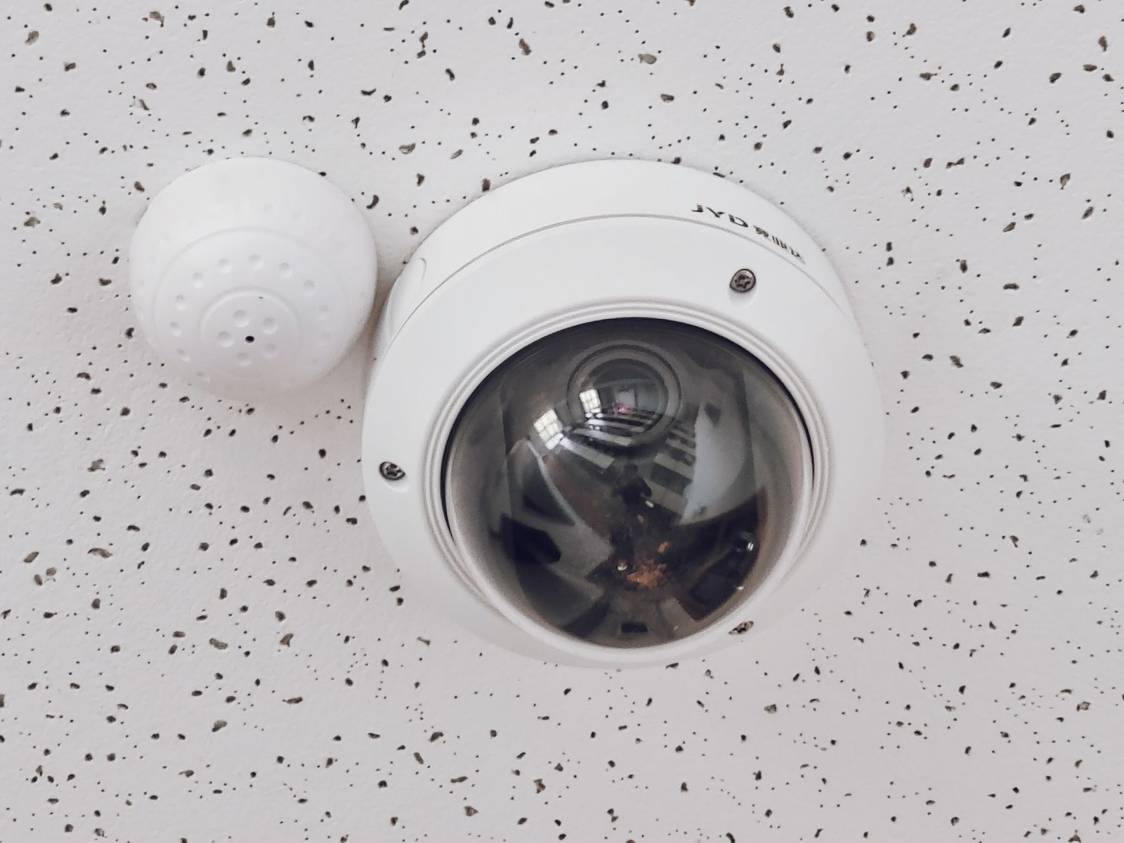 Dome security camera on a retail ceiling